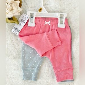 New with tags CARTER’S 2PK BABY PANTS with bow and banded bottoms 1)pink 1) Blue